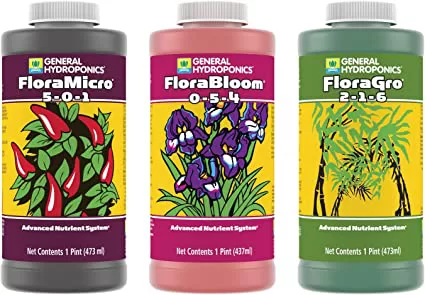 Bottle packs of commercially available General Hydroponics Flora Grow, Bloom, Micro Combo Fertilizer Set used as a hydroponic nutrient for vegetables